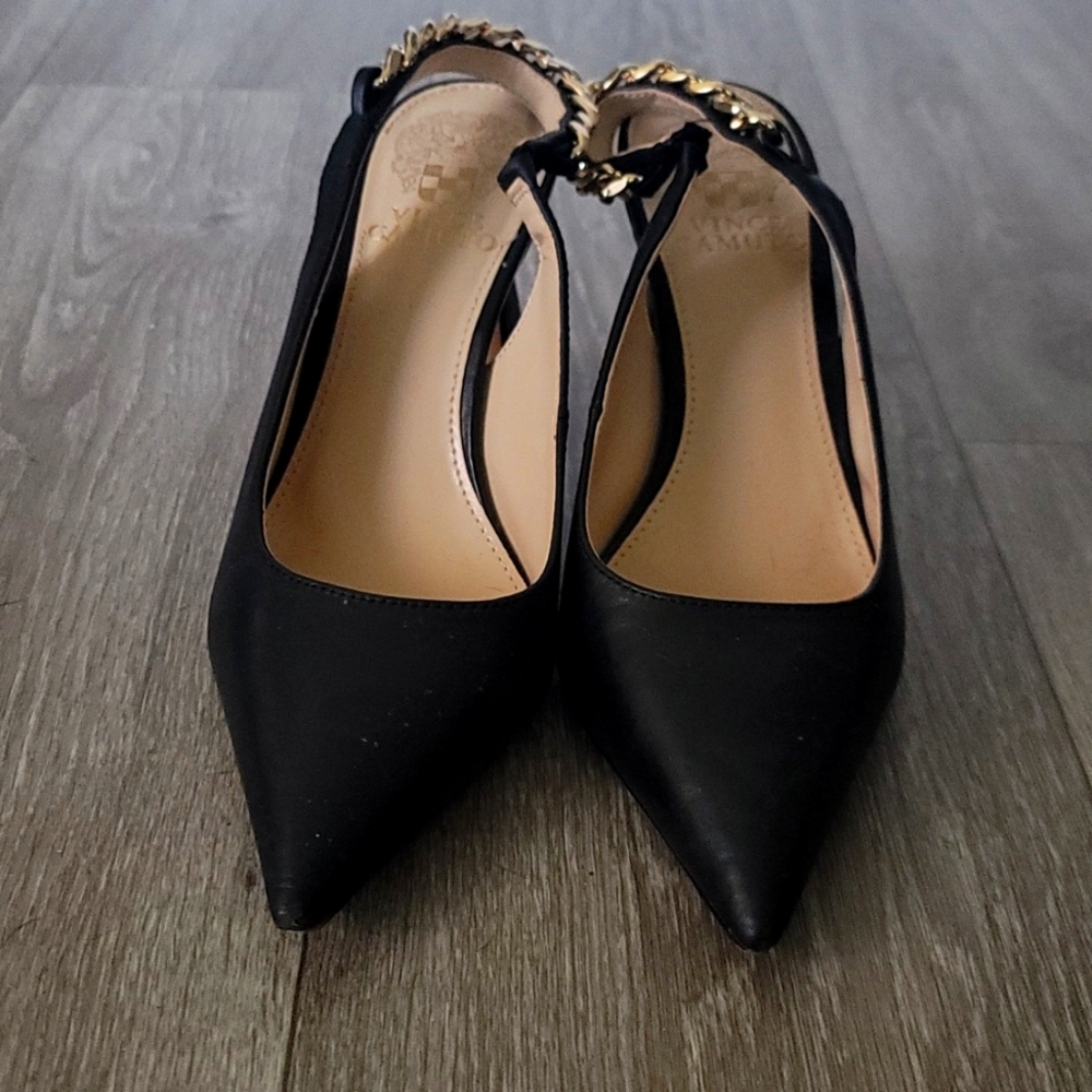 These shoes are black with a gold chain at the back